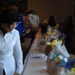 Dr. Liz Novak ('71) purusing silent auction items