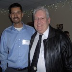 Today's band director Breysi Garcia '90 and 1980s director Zig Kanstul.