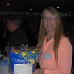Faith Sadler Chocran '80 was the winner of a door prize donated by a '62 Drill Team member Jacqueline (Mills) Nolan.